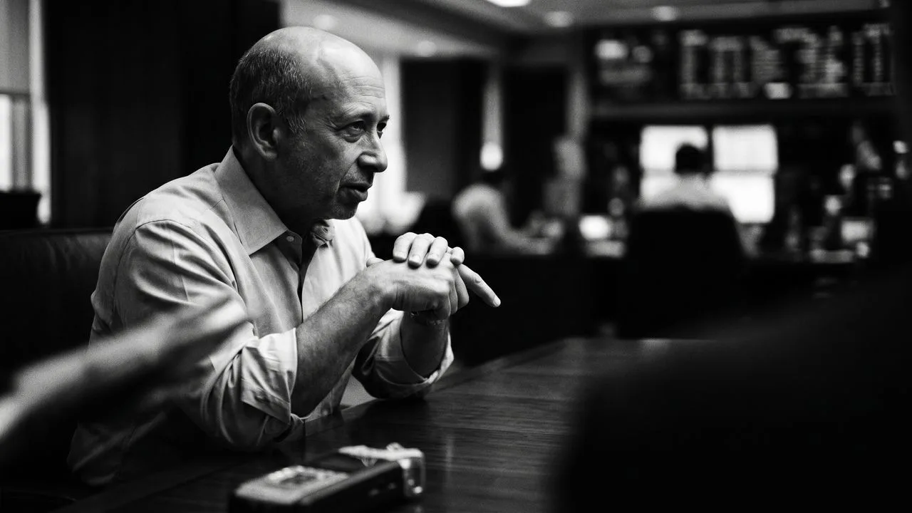 Senior executive in office setting with Wall Street Crash newspapers and financial memorabilia in background